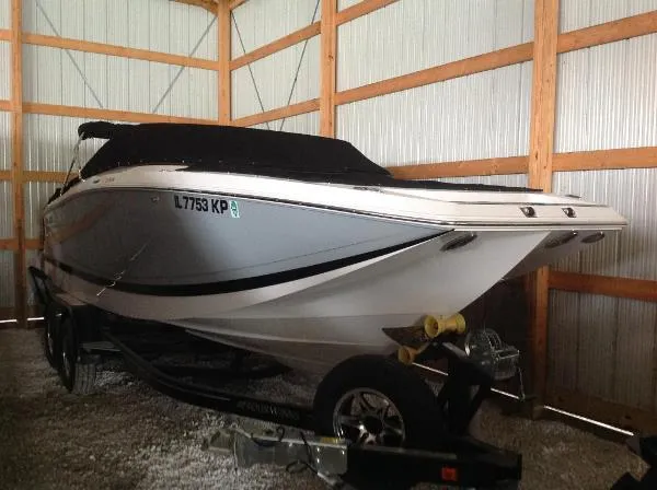 Slide: The Image of 2013 Four Winns SL242 boat in storage shed - 11