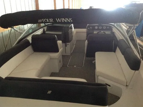 Slide: The Image of Interior view of a 2013 Four Winns SL242 boat with seating. - 15