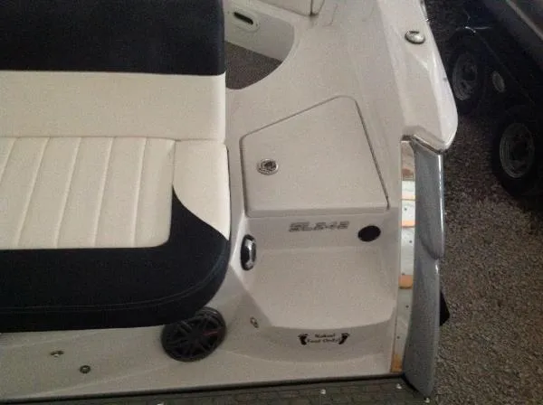 Slide: The Image of 2013 Four Winns SL242 boat interior with seating area. - 20