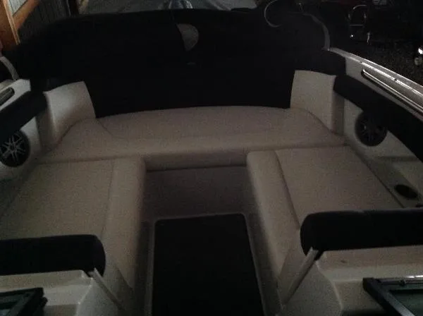 Slide: The Image of Interior of a 2013 Four Winns SL242 boat with seating area. - 21