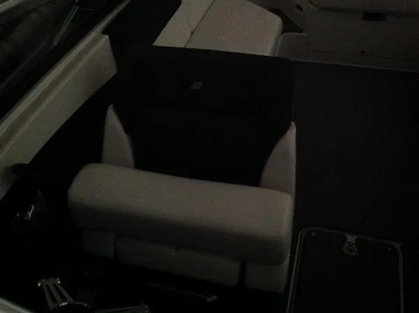 Slide: The Image of Interior of a 2013 Four Winns SL242 boat with white seating. - 23
