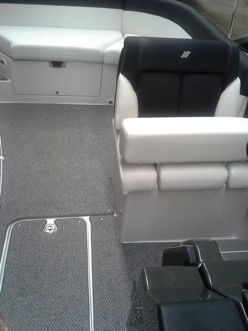 Slide: The Image of Interior of a 2013 Four Winns SL242 boat with gray carpet. - 8