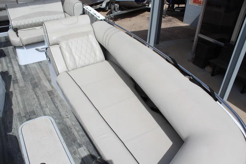 Slide: The Image of Luxurious seating on 2019 Crest Savannah 250 SLRC pontoon boat, featuring elegant upholstery. - 18
