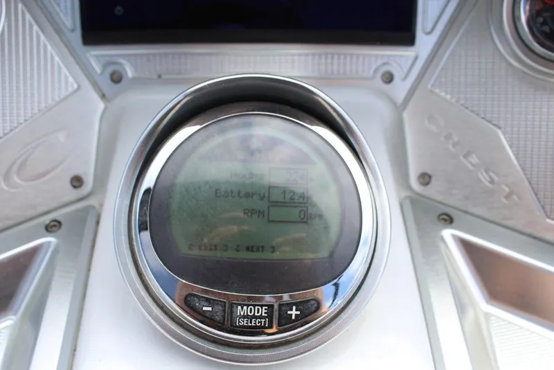 Slide: The Image of Close-up of 2019 Crest Savannah 250 SLRC dashboard display showing battery and RPM. - 21