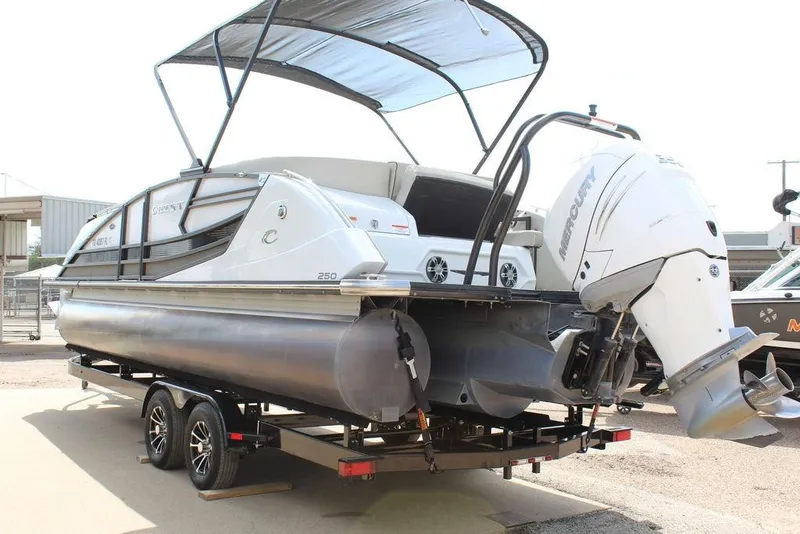 Slide: The Image of 2019 Crest Savannah 250 SLRC pontoon boat on trailer with Mercury outboard motor. - 4
