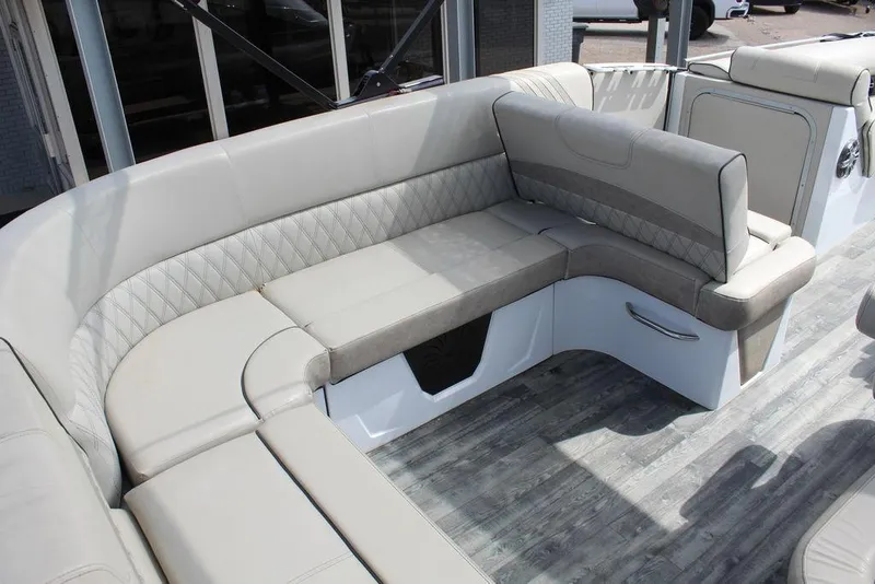 Slide: The Image of Luxurious seating on 2019 Crest Savannah 250 SLRC pontoon boat, featuring elegant upholstery. - 8