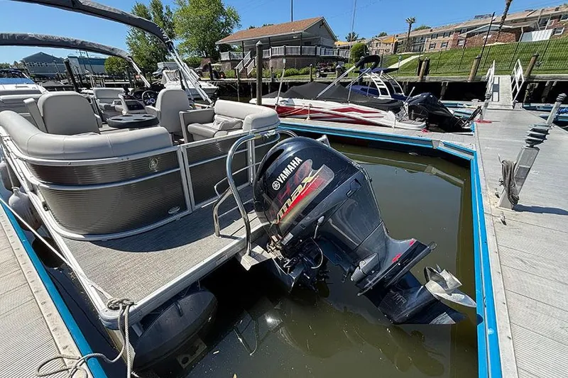 Slide: The Image of Pontoon boat Godfrey Sweetwater 2286 SBX 2022 partially submerged at dock with Yamaha motor. - 3