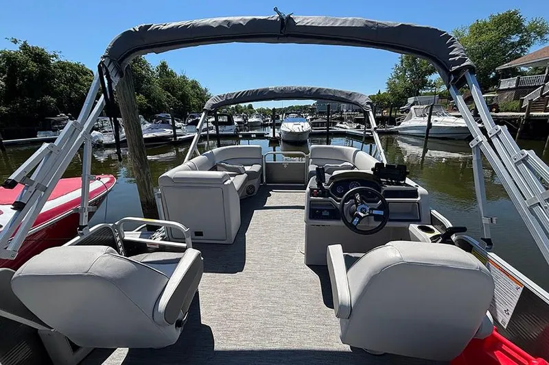 Slide: The Image of 2022 Godfrey Sweetwater 2286 SBX pontoon boat interior at a marina. - 7