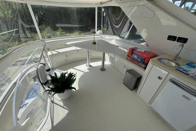 Slide: The Image of Luxurious 2007 Marquis 55 LS yacht bedroom with elegant wood finishes and plush bedding. - 13