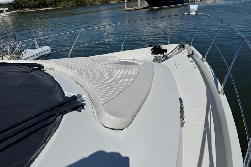 Slide: The Image of Luxurious 2007 Marquis 55 LS yacht bedroom with elegant wood cabinetry and nautical-themed decor. - 14