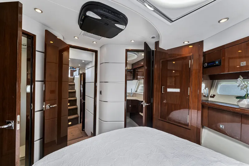 Slide: The Image of Luxurious interior of a 2007 Marquis 55 LS yacht with elegant wood finishes. - 16