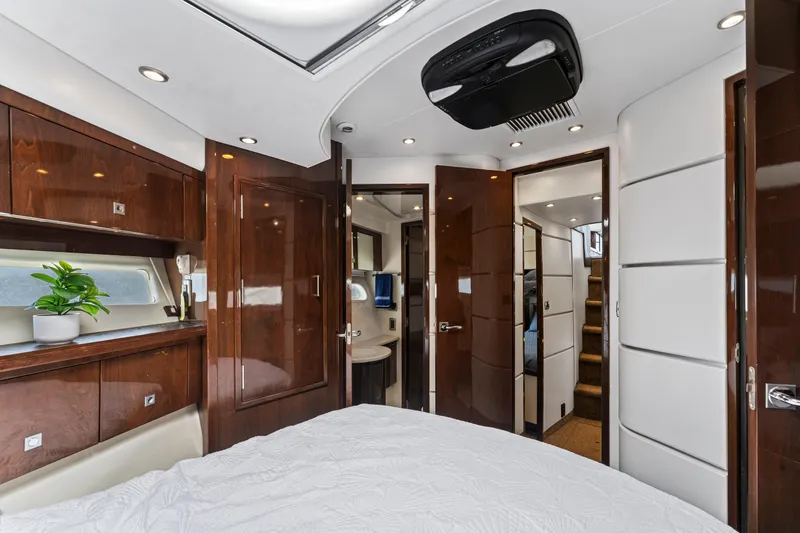 Slide: The Image of Luxurious interior of 2007 Marquis 55 LS yacht with elegant wood finishes and modern design. - 18