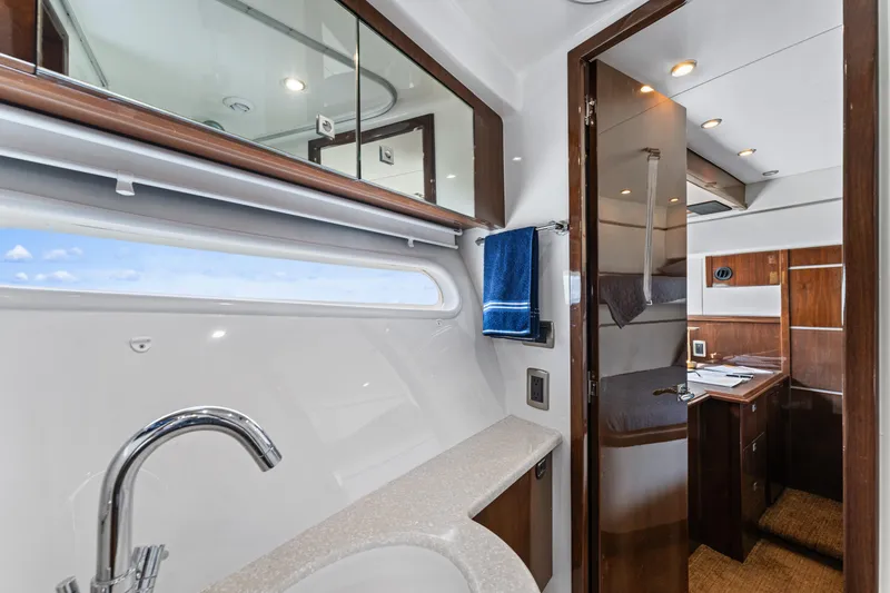 Slide: The Image of Luxurious bathroom interior of 2007 Marquis 55 LS yacht with modern fixtures and wood accents. - 21