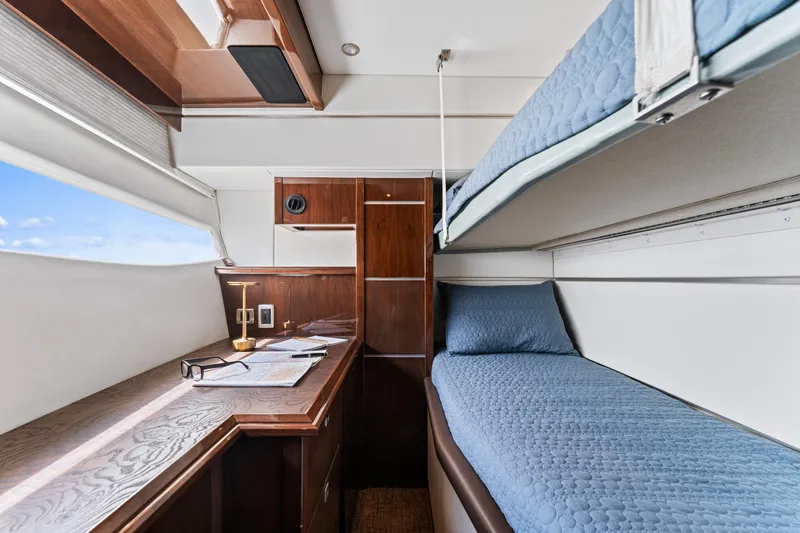 Slide: The Image of Luxurious cabin interior of 2007 Marquis 55 LS yacht with bunk beds and desk. - 24