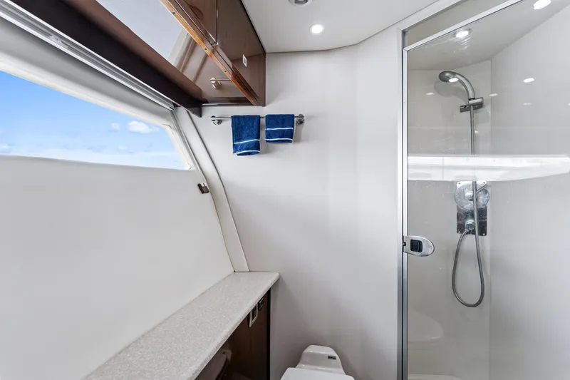 Slide: The Image of Luxurious bathroom in 2007 Marquis 55 LS yacht with shower and towels. - 26