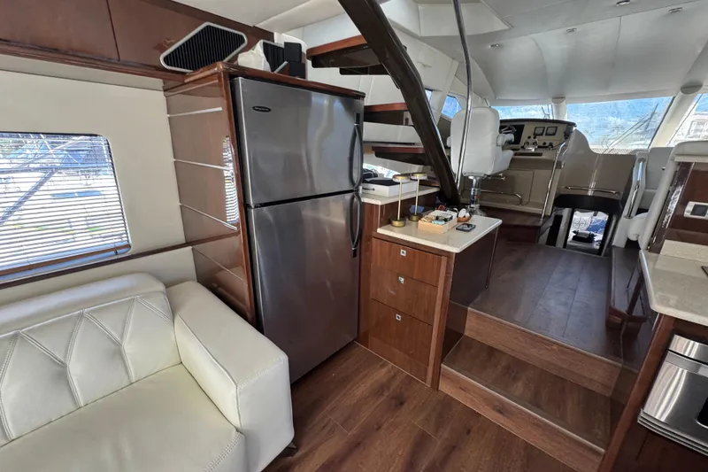 Slide: The Image of Luxurious 2007 Marquis 55 LS yacht docked at marina during sunset. - 3