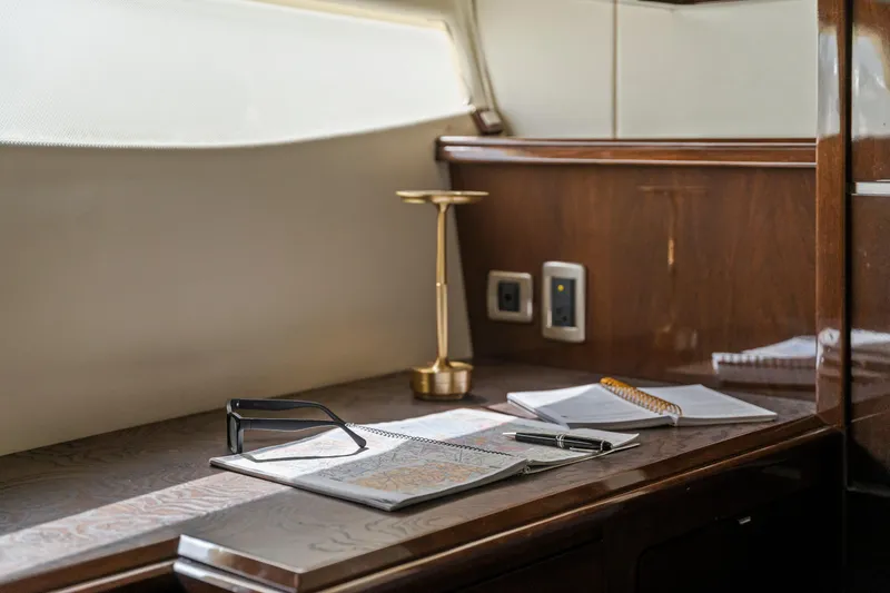 Slide: The Image of Luxurious interior of 2007 Marquis 55 LS yacht with desk, lamp, and stationery. - 30