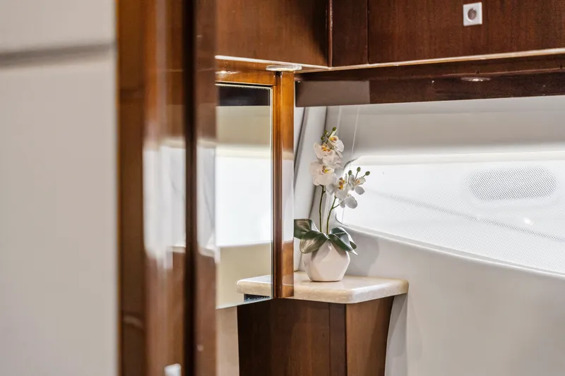 Slide: The Image of Luxurious interior of 2007 Marquis 55 LS yacht with elegant wood finish and floral decor. - 31