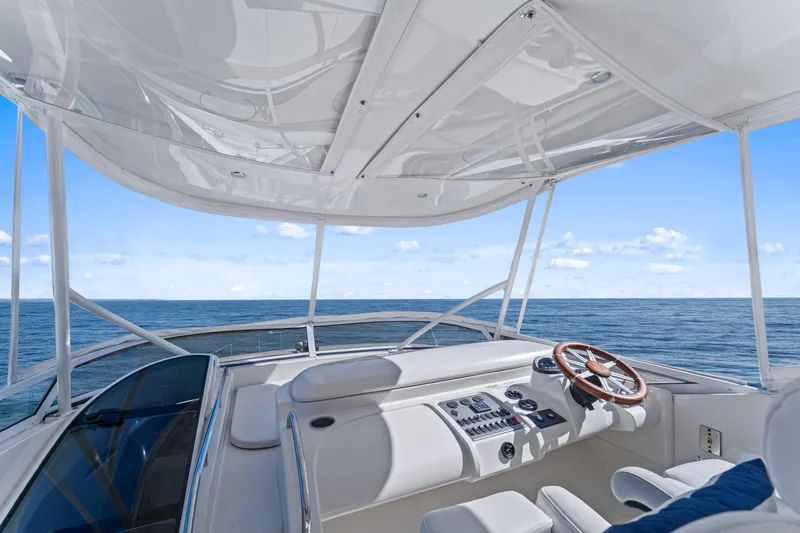 Slide: The Image of Luxurious 2007 Marquis 55 LS yacht helm with ocean view and sleek design. - 32