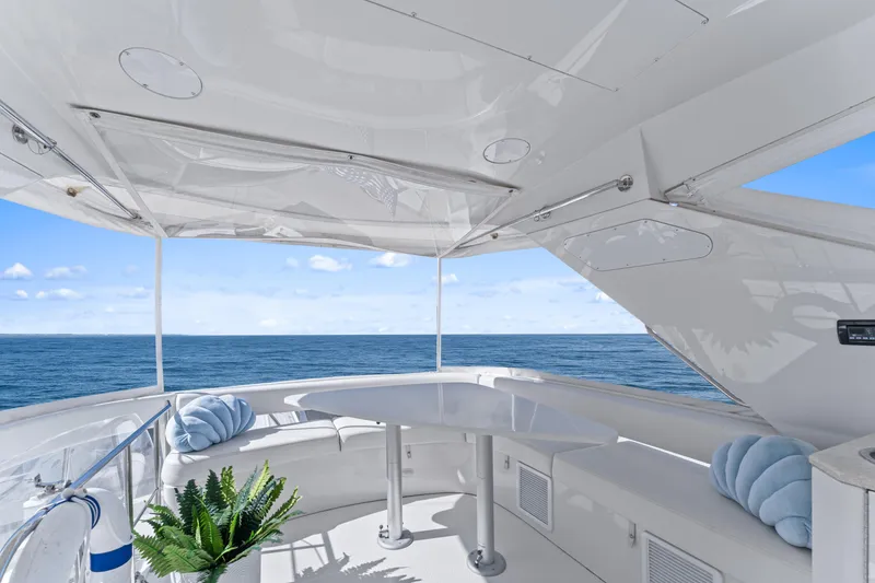 Slide: The Image of Luxurious 2007 Marquis 55 LS yacht deck with ocean view, featuring elegant seating and decor. - 33