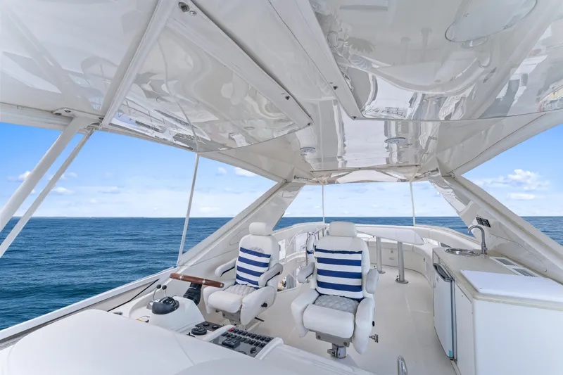 Slide: The Image of Luxurious 2007 Marquis 55 LS yacht interior with ocean view and plush seating. - 36