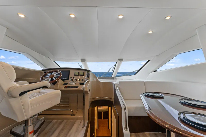 Slide: The Image of Luxurious interior of 2007 Marquis 55 LS yacht with helm and seating area. - 39