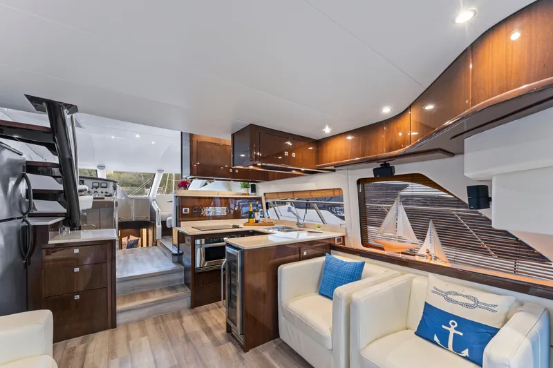Slide: The Image of Luxurious interior of a 2007 Marquis 55 LS yacht with modern kitchen and seating area. - 41