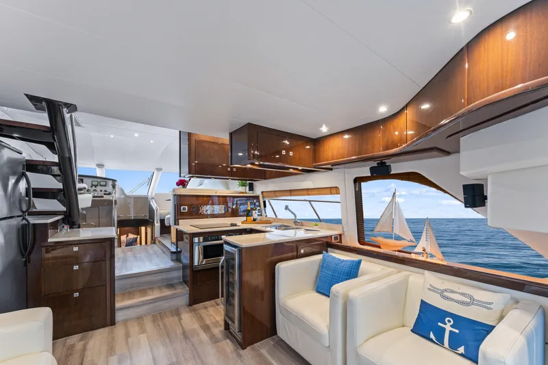 Slide: The Image of Luxurious interior of 2007 Marquis 55 LS yacht with ocean view and elegant furnishings. - 42