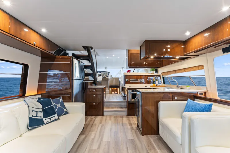 Slide: The Image of Luxurious interior of 2007 Marquis 55 LS yacht with elegant wood finishes and ocean view. - 43