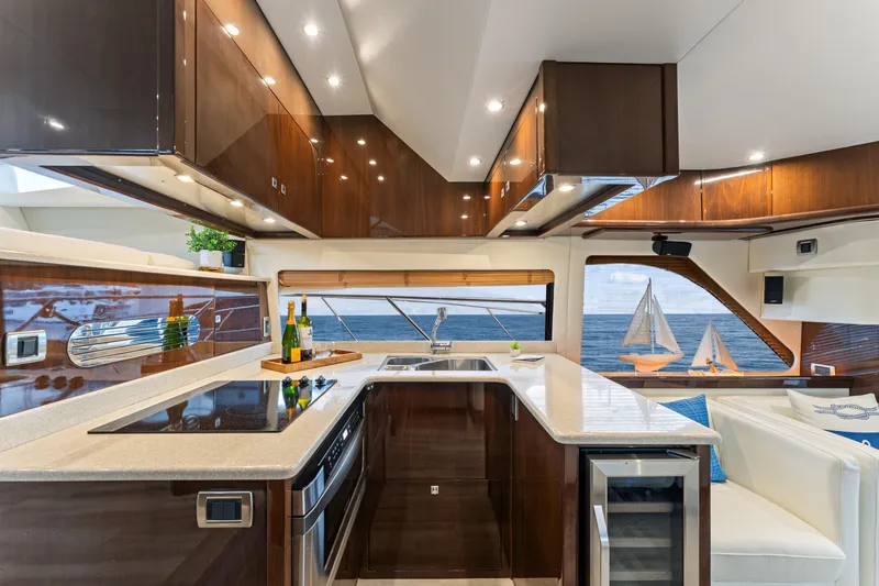 Slide: The Image of Luxurious 2007 Marquis 55 LS yacht kitchen with modern amenities and ocean view. - 46