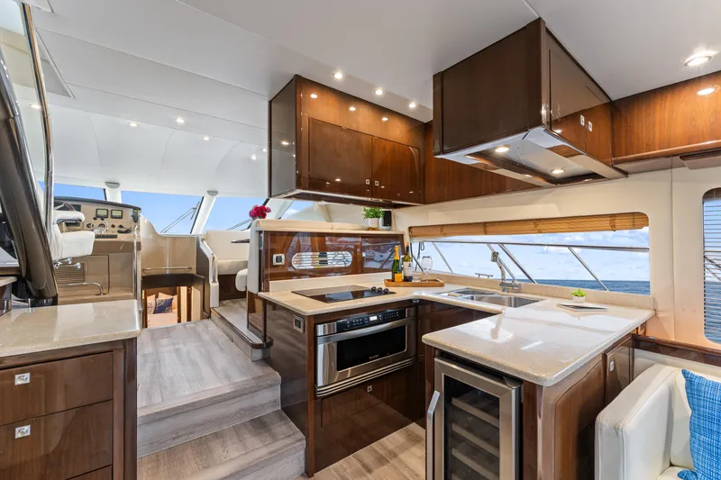 Slide: The Image of Luxurious interior of a 2007 Marquis 55 LS yacht with modern kitchen and ocean view. - 48