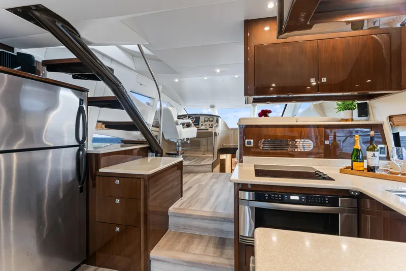 Slide: The Image of Luxurious interior of a 2007 Marquis 55 LS yacht with modern kitchen amenities. - 49