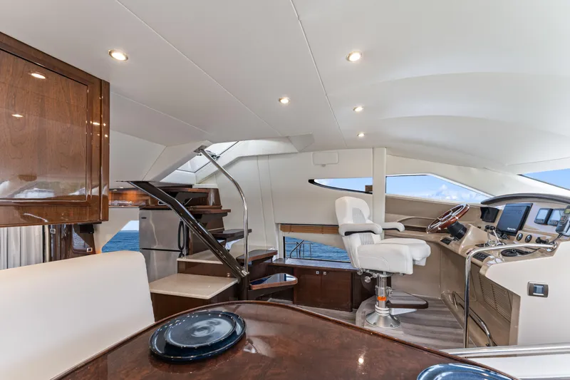 Slide: The Image of Luxurious interior of a 2007 Marquis 55 LS yacht with modern helm and seating. - 50