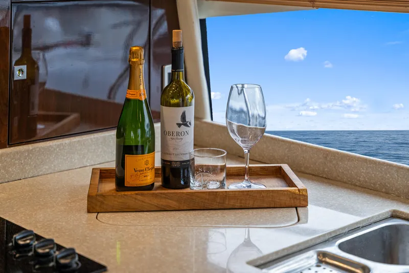 Slide: The Image of Luxury yacht interior with wine and champagne, ocean view through window, Marquis 55 LS 2007. - 51