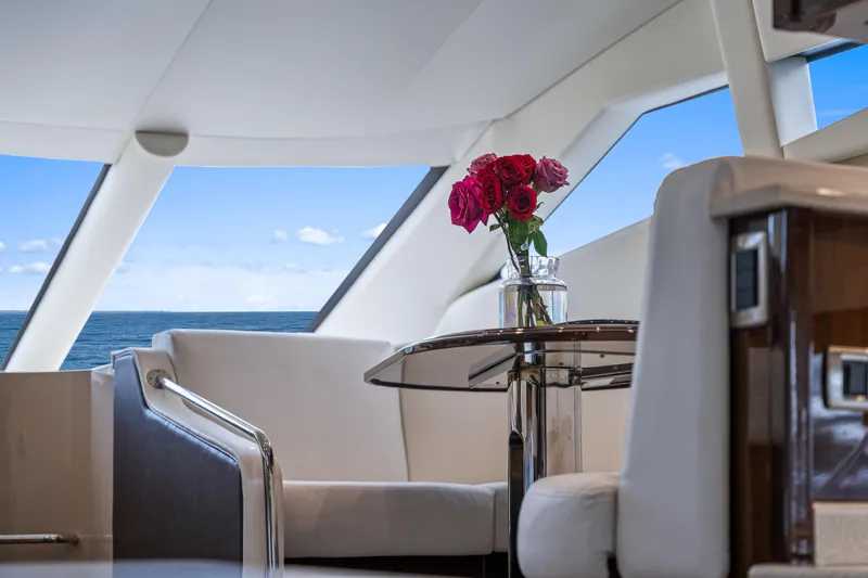 Slide: The Image of Luxurious interior of 2007 Marquis 55 LS yacht with ocean view and roses on table. - 52