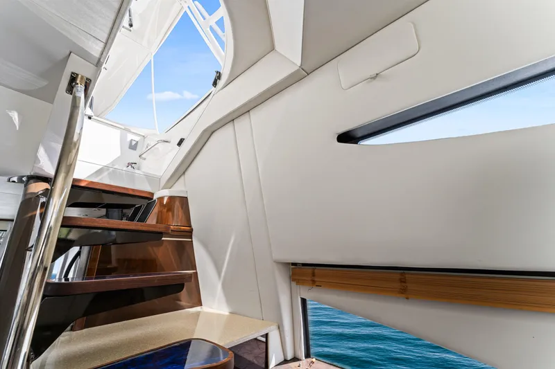 Slide: The Image of Interior view of 2007 Marquis 55 LS yacht, featuring sleek stairs and ocean view. - 61