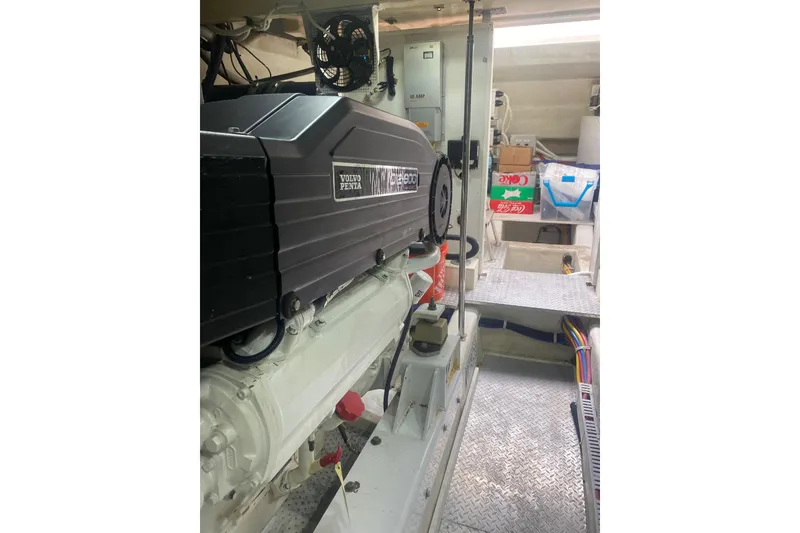 Slide: The Image of Engine room of a 2007 Marquis 55 LS yacht featuring a Volvo Penta engine. - 68