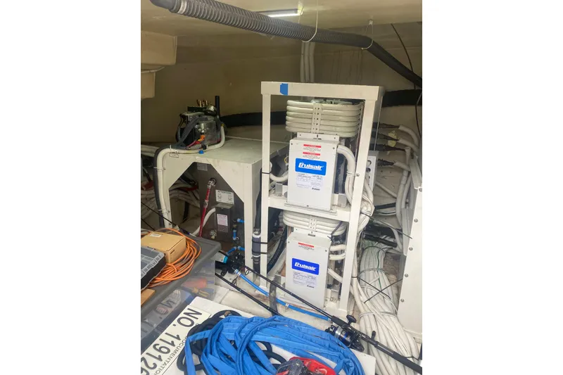 Slide: The Image of Engine room of a 2007 Marquis 55 LS yacht with electrical equipment and cables. - 71
