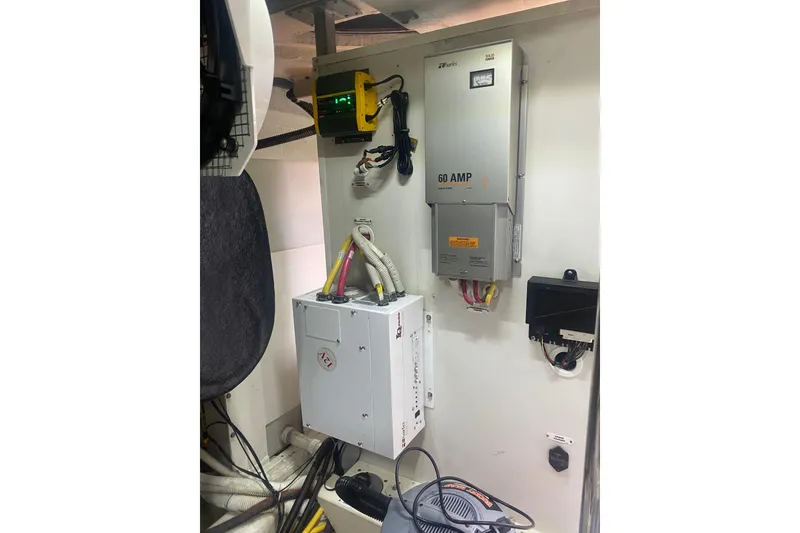 Slide: The Image of Electrical panel setup in a 2007 Marquis 55 LS yacht engine room. - 73