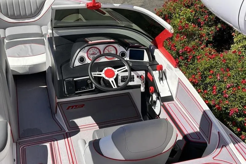 Slide: The Image of 2023 MB SPORTS F22 Tomcat Alpha boat interior with sleek design and modern dashboard. - 7