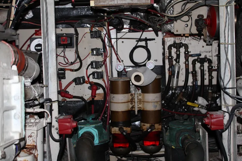 Slide: The Image of Engine room of a 1988 Chris Craft Constellation boat with complex wiring and machinery. - 40