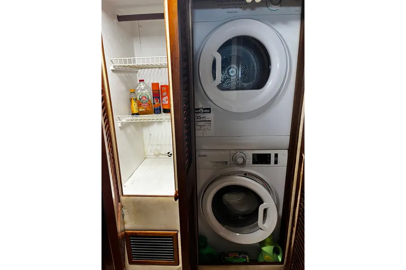 Slide: The Image of Laundry area with stacked washer and dryer in 1988 Chris Craft Constellation boat. - 21