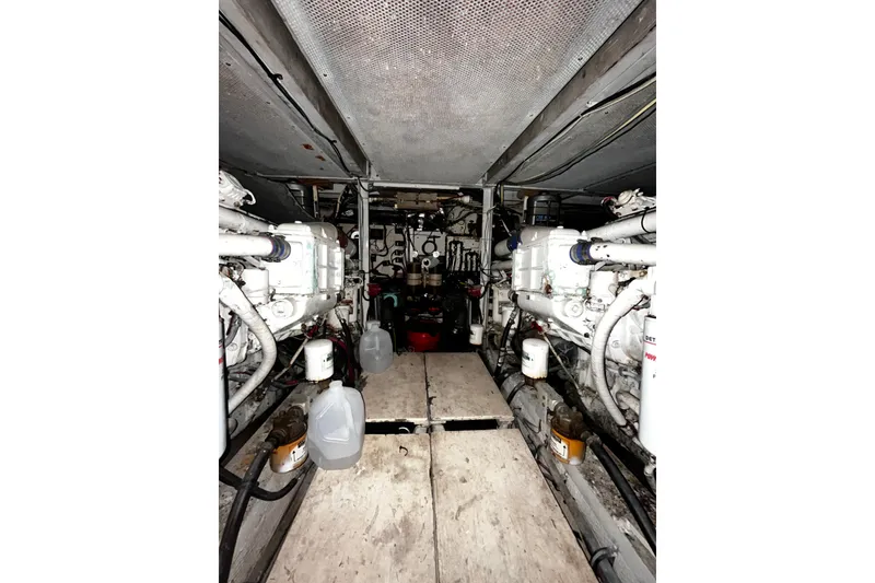 Slide: The Image of Engine room of 1988 Chris Craft Constellation yacht, showcasing dual engines and mechanical components. - 39