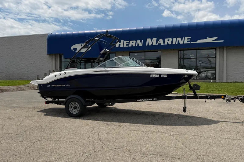 The Image of 2017 Chaparral 19 H2O Sport boat on trailer outside Hern Marine dealership. - 0
