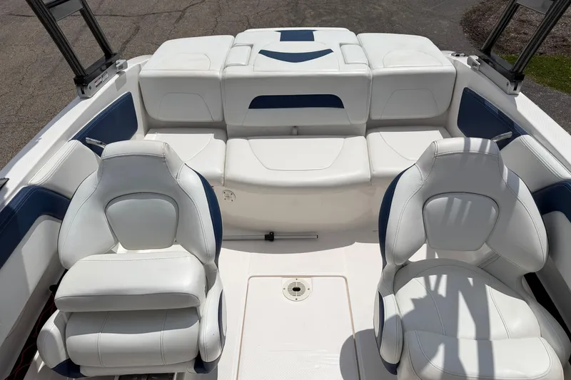 Slide: The Image of 2017 Chaparral 19 H2O Sport boat interior with white and blue seating. - 11