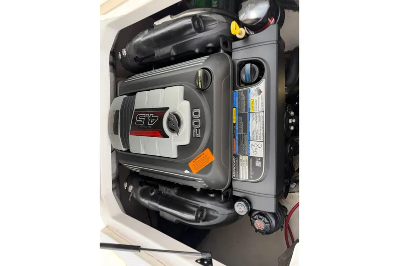 Slide: The Image of Engine compartment of a 2017 Chaparral 19 H2O Sport boat, featuring a 4.5L Mercury engine. - 16