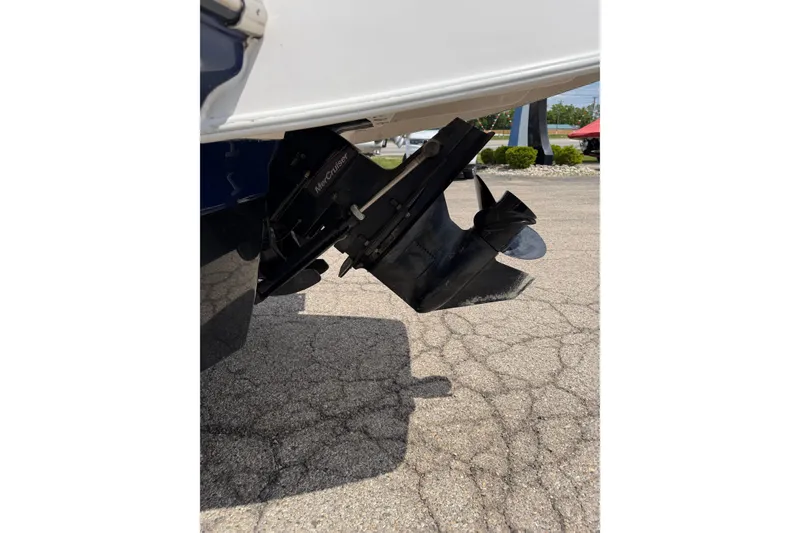 Slide: The Image of 2017 Chaparral 19 H2O Sport boat with MerCruiser outdrive on pavement. - 18