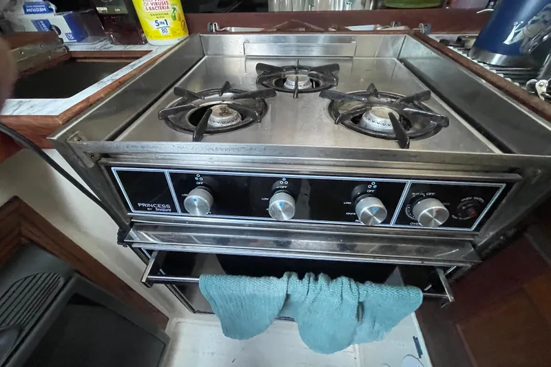 Slide: The Image of Vintage 1977 Catalina stove with dual burners and oven, featuring classic control knobs. - 18