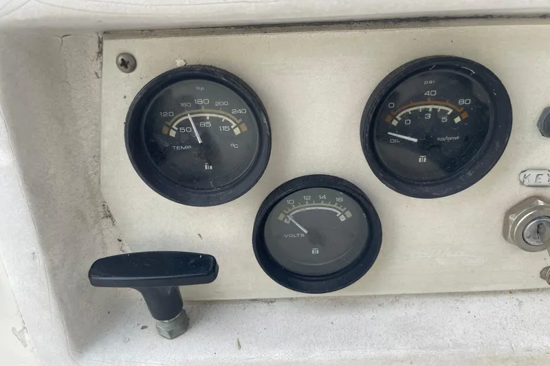 Slide: The Image of 1977 Catalina dashboard with temperature, oil, and voltage gauges. - 21