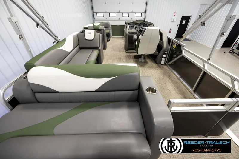 Slide: The Image of 2024 Avalon LSZ CRB pontoon boat interior with green and gray seating. - 16